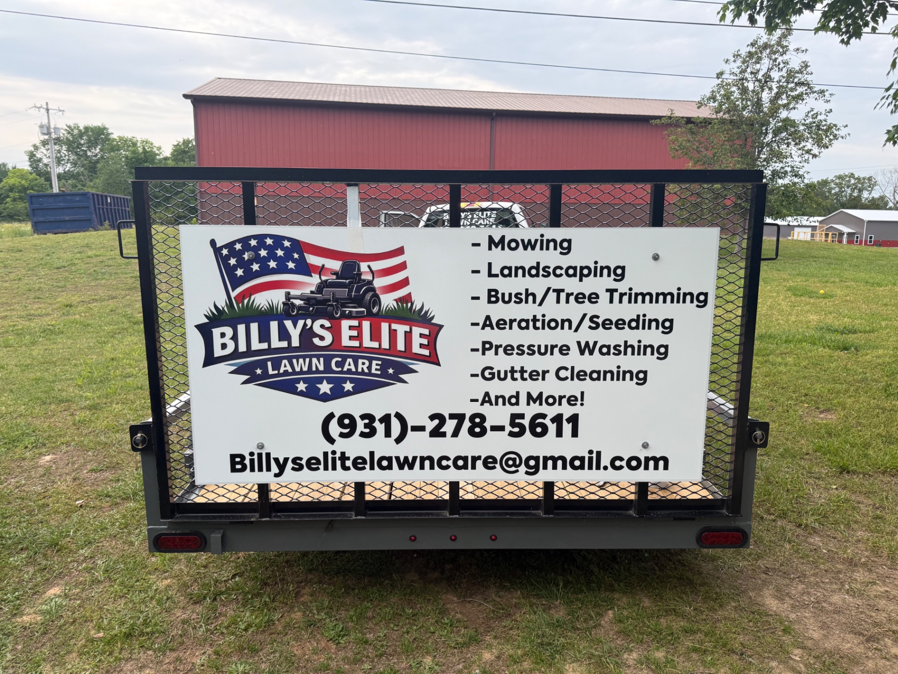 Billy's Elite Lawn Care trailer with services list