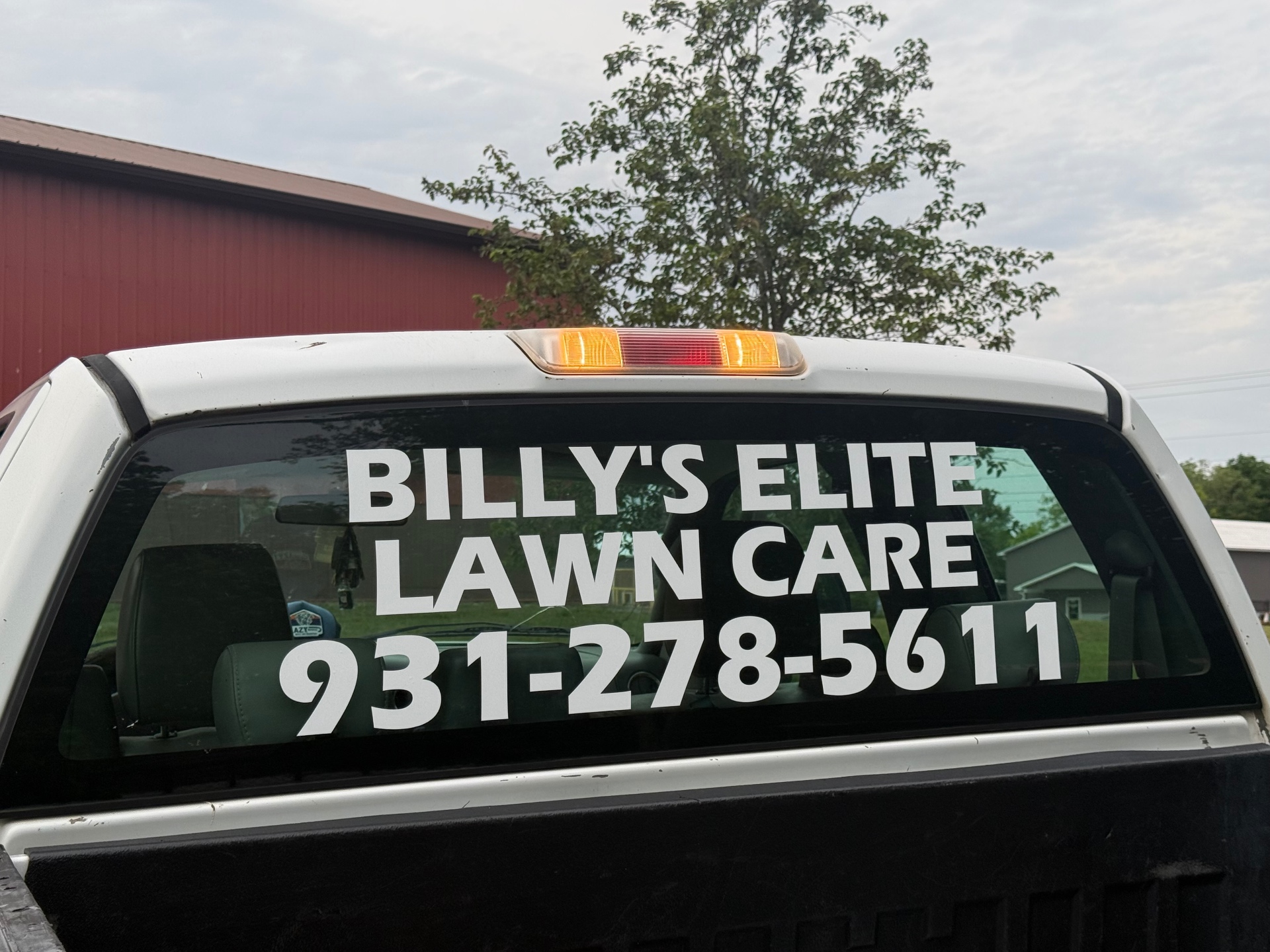 Billy's Elite Lawn Care truck signage